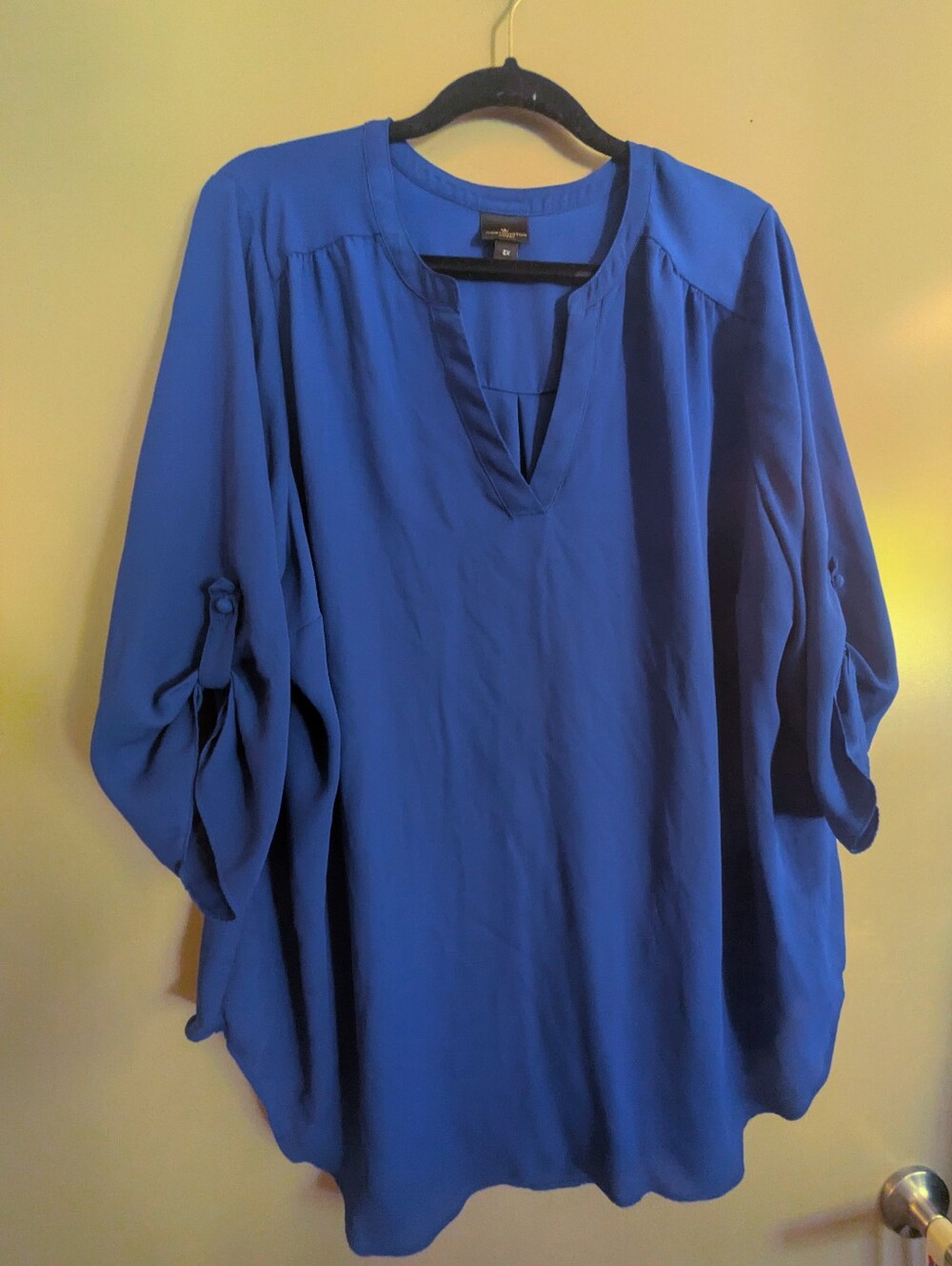 Plus Size Worthington blue blouse with rolled long sleeves and button detail.